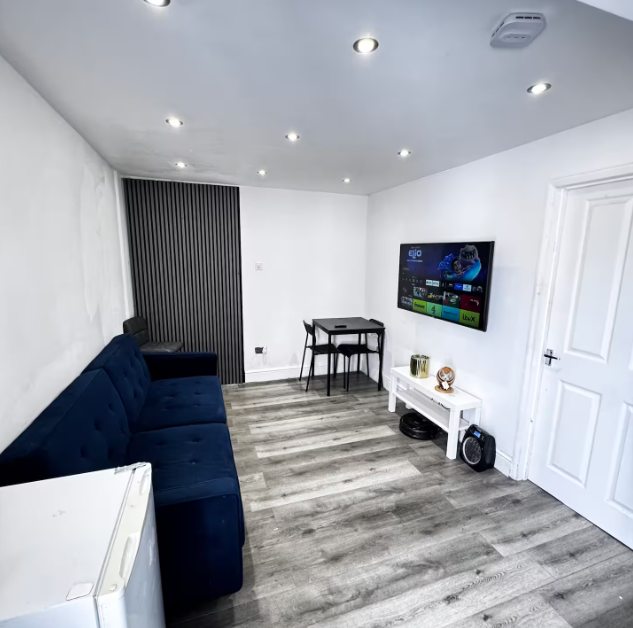 Whitehall Lane one-bedroom apartment photo 3: living room and kitchen area.