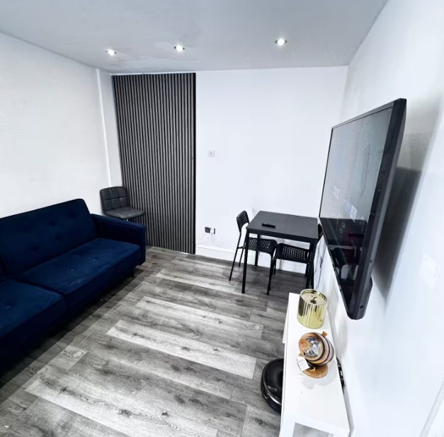 Whitehall Lane one-bedroom apartment photo 4: living room and kitchen area.